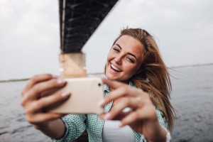 Girl smiling taking selfie