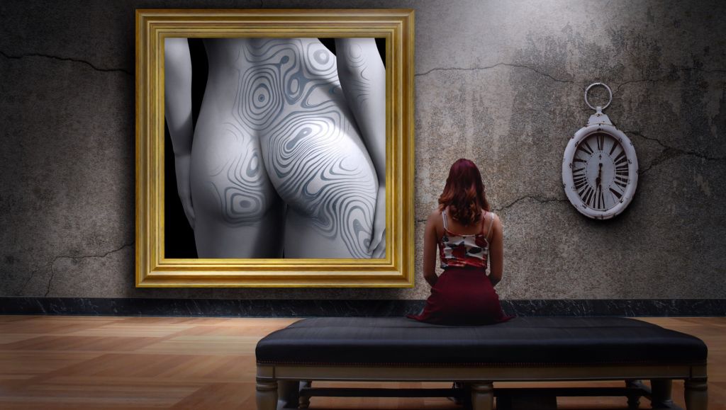 Woman looking at representation of female body